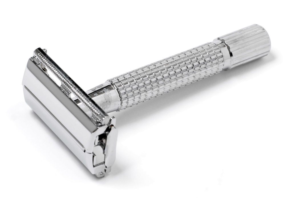 Chrome safety razor on a white background